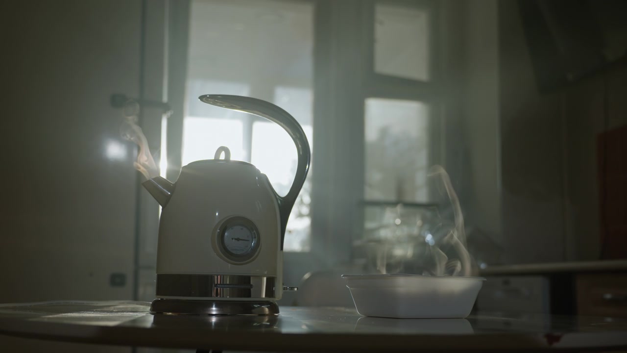 Backlit kettle with bright sunlight, strong lens flare and steam rising against window, reflective metal spout and handle on kitchen counter, atmospheric haze and warm cinematic glow, dramatic morning