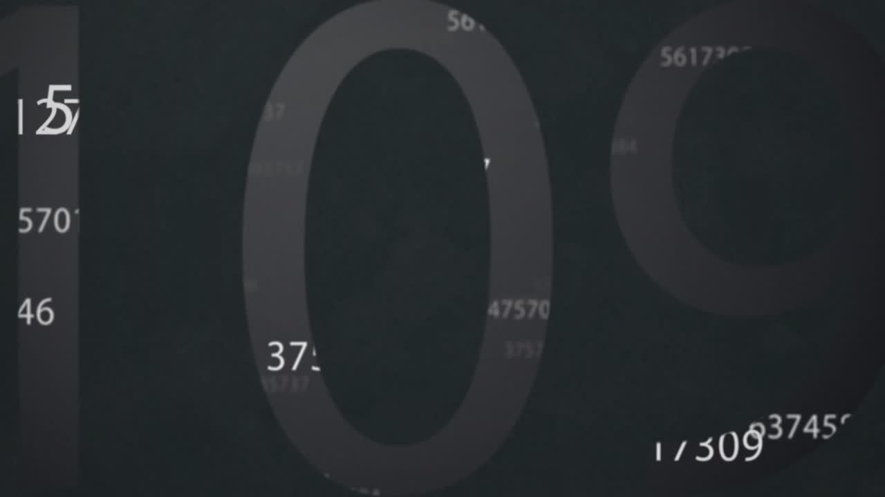 Animation of white numbers changing and processing on grey background