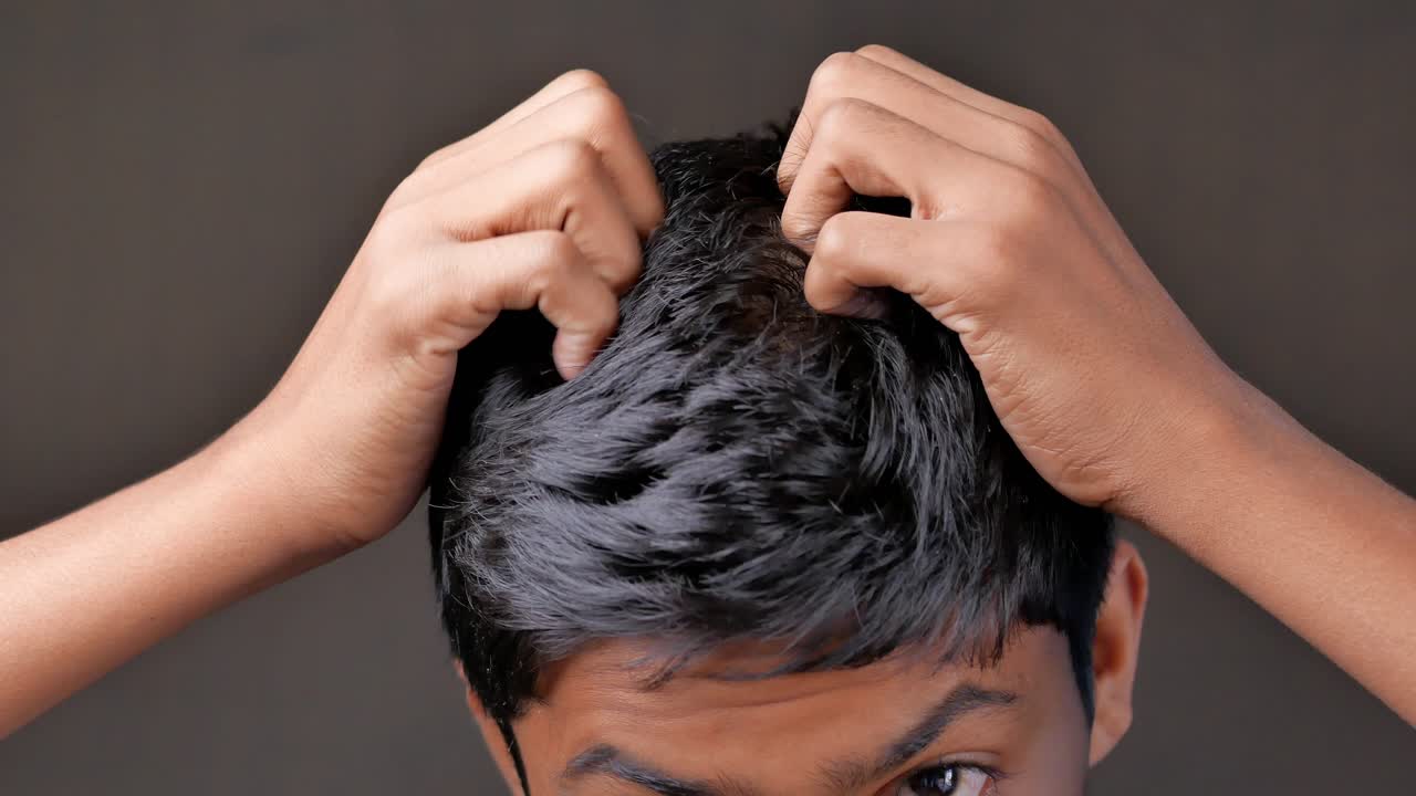 Person scratching their head