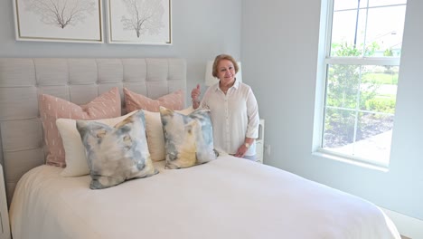 woman stands by the purchase of her new bed and is pleased with her purchase