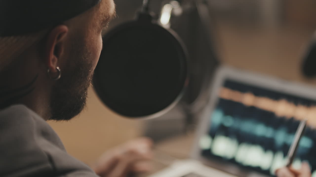 Slowmo of Podcast Host Talking Into Microphone