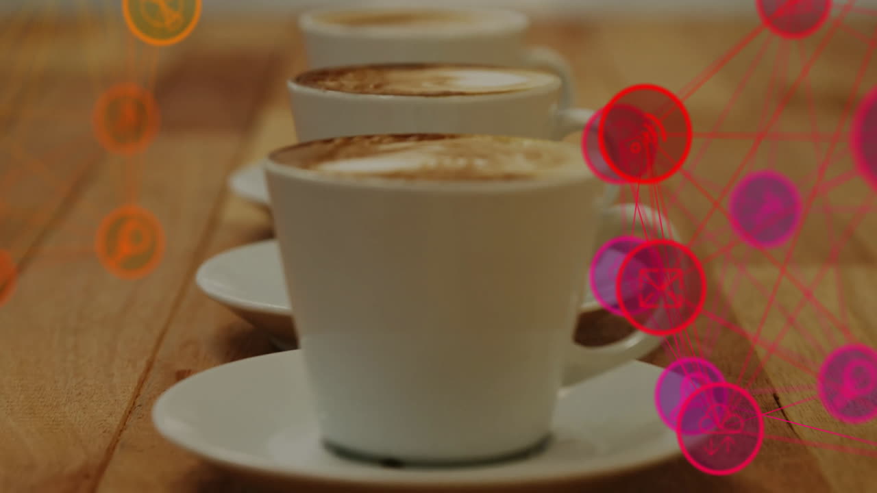 White ceramic coffee cup sitting on wooden tabletop, digital network overlay glowing in red orange