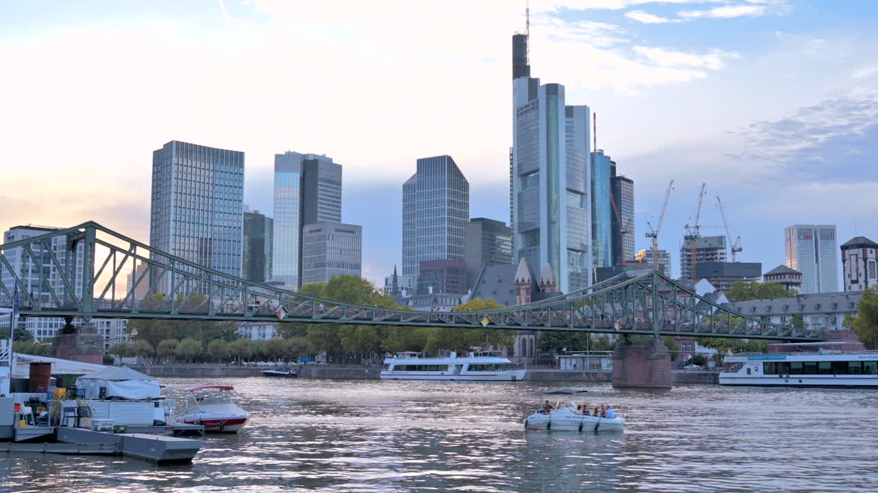 Frankfurt, Germany - September 15, 2022: Boats moving under the Iron Footbridge