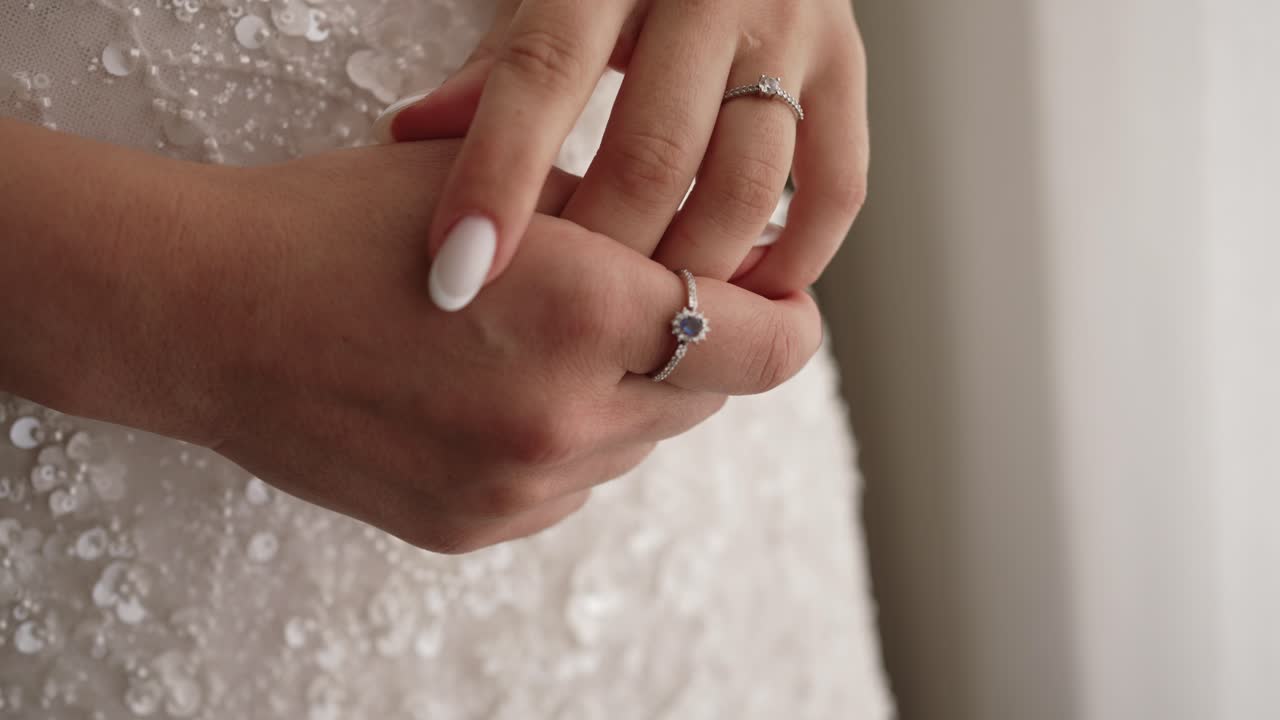 Intimate sparkle of gemstone jewelry and polished fingers in bridal elegance