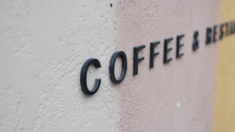 coffee & restaurant sign on a wall