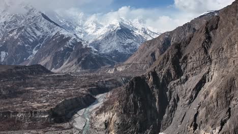 Gilgit-baltistan,-Khunjerab-pass,-Pakistan,-a-new-frontier,-old-Silk-Road-with-new-facelift,-Karakoram-new-highway-with-snowy-mountain-in-the-background