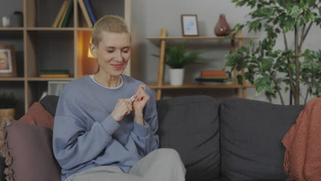 woman reacts to a positive pregnancy test