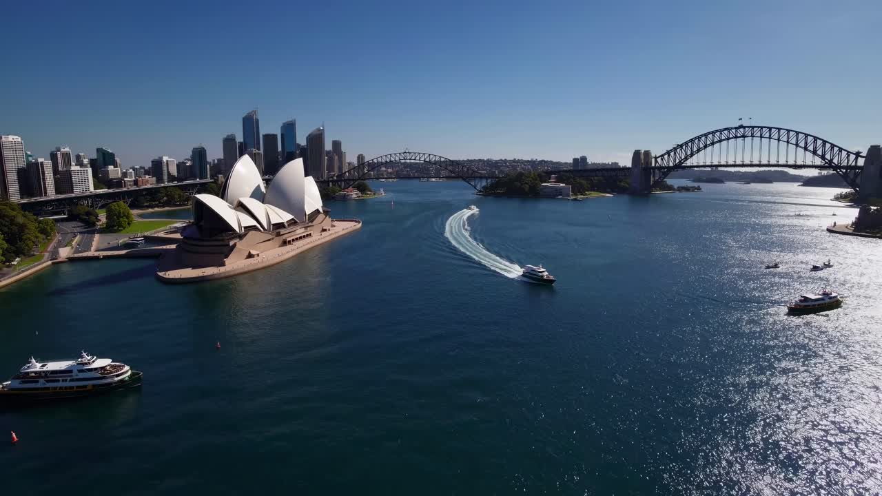 Aerial video captures Sydney Opera House and Harbour Bridge from above, showcasing stunning