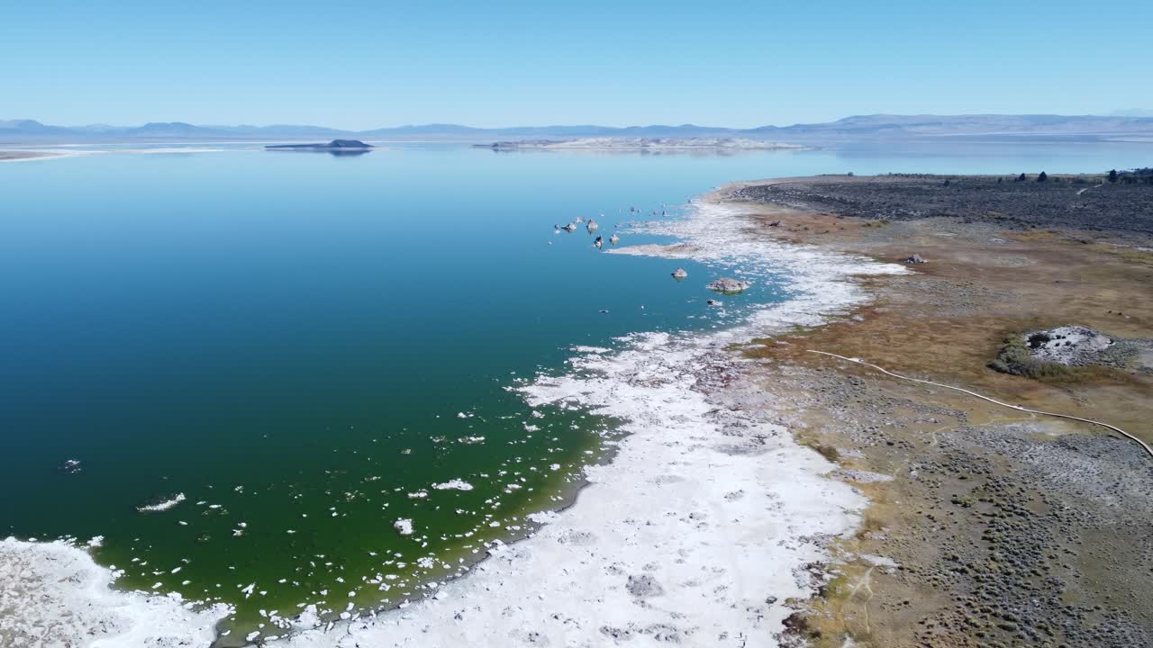 A drone rotation shot over a shoreline