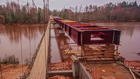 long time lapse of a steel bridge being constructed over the gauja river in latvia