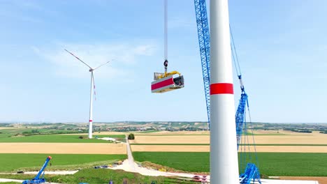 Construction-Of-Windmill-During-Summer---drone-shot