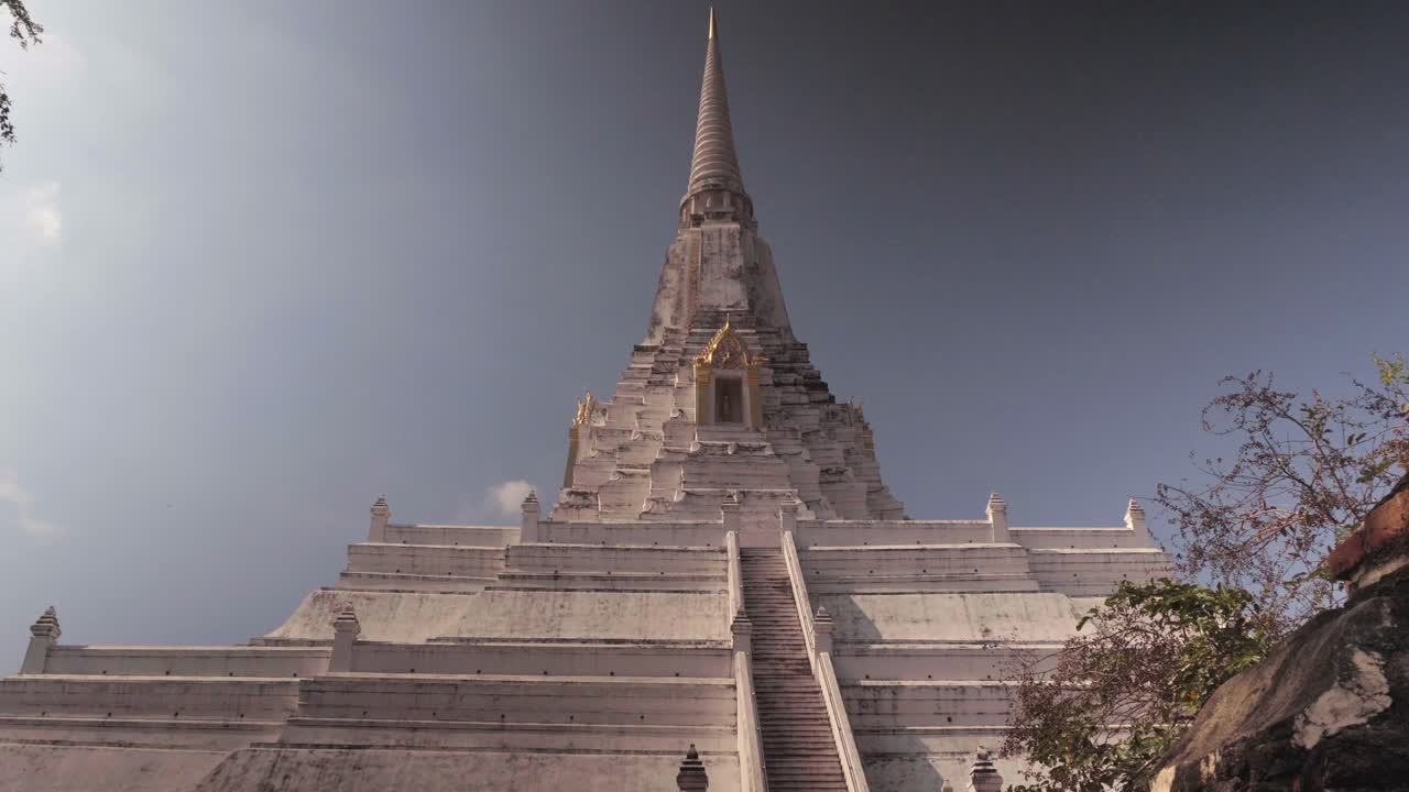 A tilt establishing shot of the spectacular Wat Phy Khao Thong, one of the many beautiful temples in the Ayutthaya Kingdom in Thailand