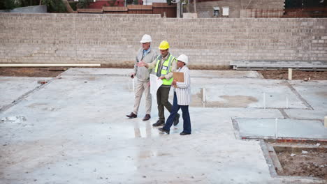 construction workers inspecting building site