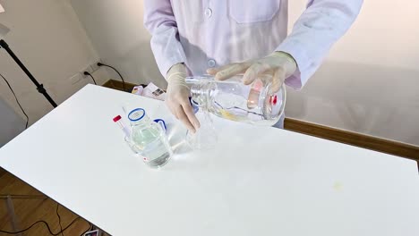a scientist performs a chemical experiment with potassium permanganate, demonstrating a color change reaction under controlled lighting