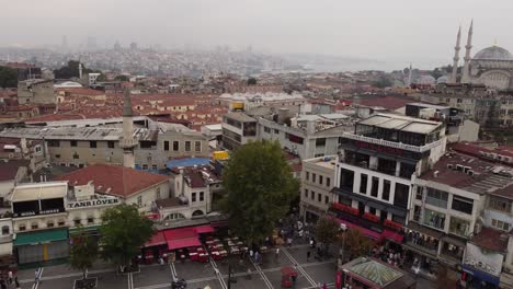 Roof-top-view-of-grand-bazaar-building-with-mosque-and-the-city-in-the-background