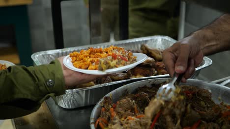 Hands-IDF-Israeli-Soldier-Receiving-Food-on-Plastic-Plate-At-Training-Ground-Kitchen-Buffet-Inside-Tent-From-Army-Cook--slow-motion