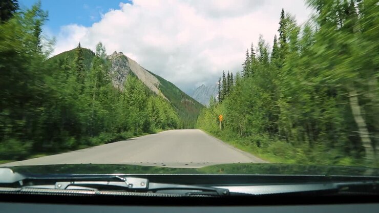 Driving On Scenic Country Road With Stunning View Of Canadian Rockies