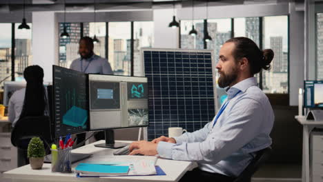 portrait of happy sustainable energy researcher using simulation software