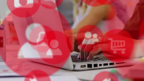 Animation-of-multiple-icons-over-cropped-hands-of-caucasian-woman-typing-on-keyboard-of-laptop