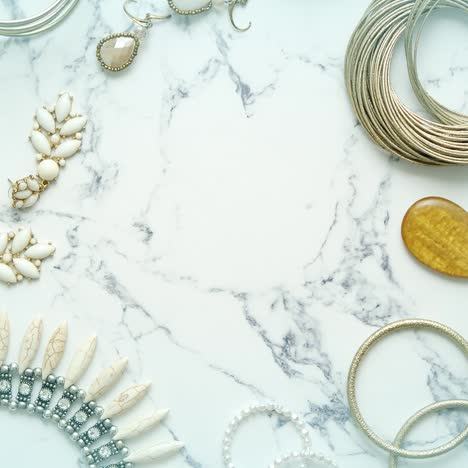 various jewelry for a female  elegant style  placed on marble table