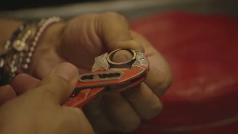 italian goldsmith at work building an engagement or a wedding ring