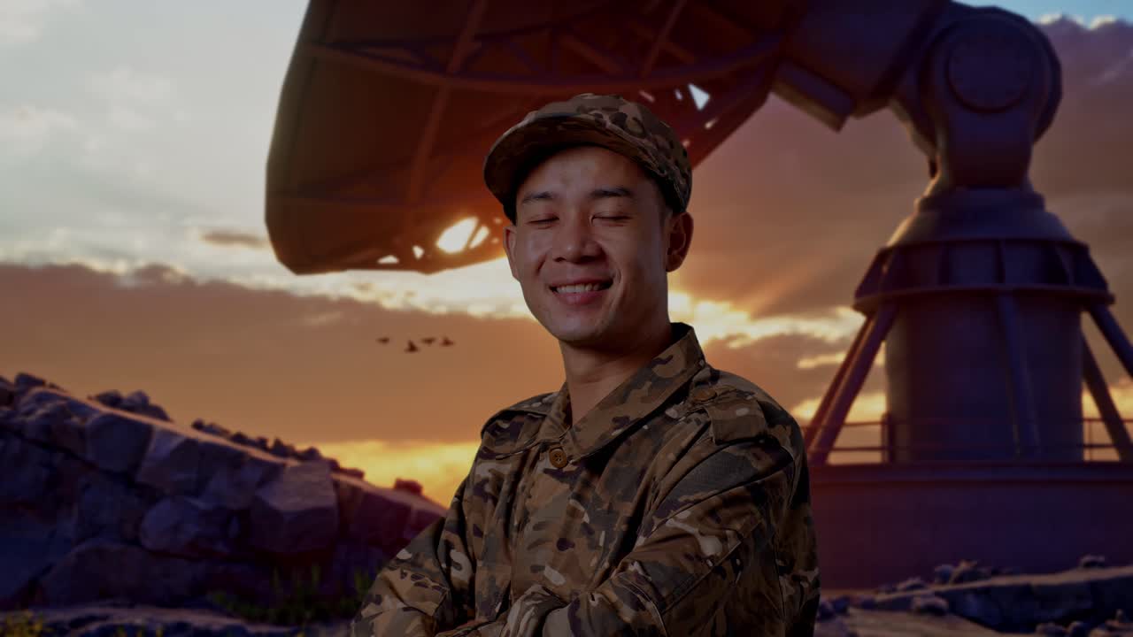 Close Up Of Side View Of Asian Man Soldier Smiling And Crossing His Arms While Standing With Satellite Dish
