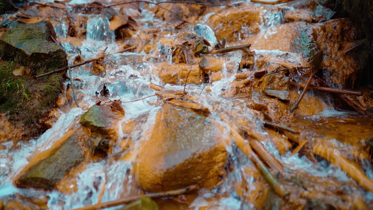 Slow motion of beautiful sulfur spring waterfall in forest.
