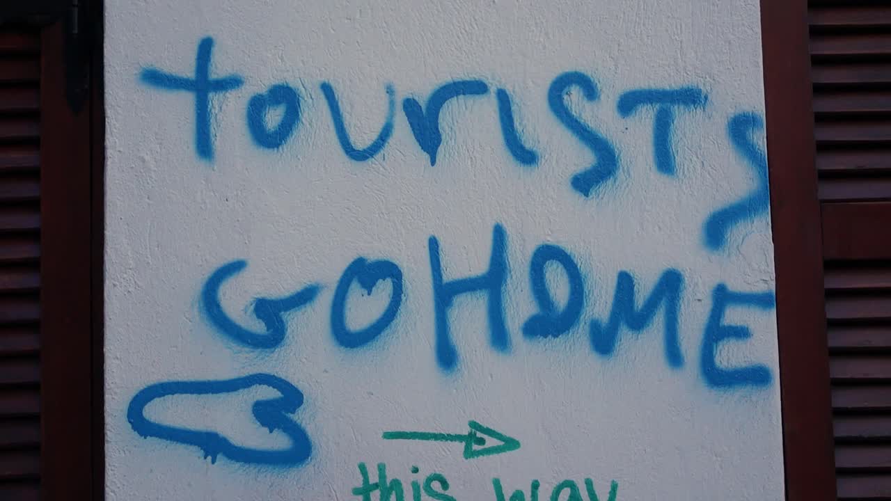 Graffiti Message: Tourists Go Home