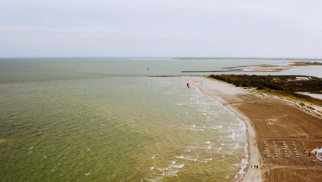 Aerial-circling-over-kitesurfer-kitesurfing-at-Porto-Barricata-in-Italy