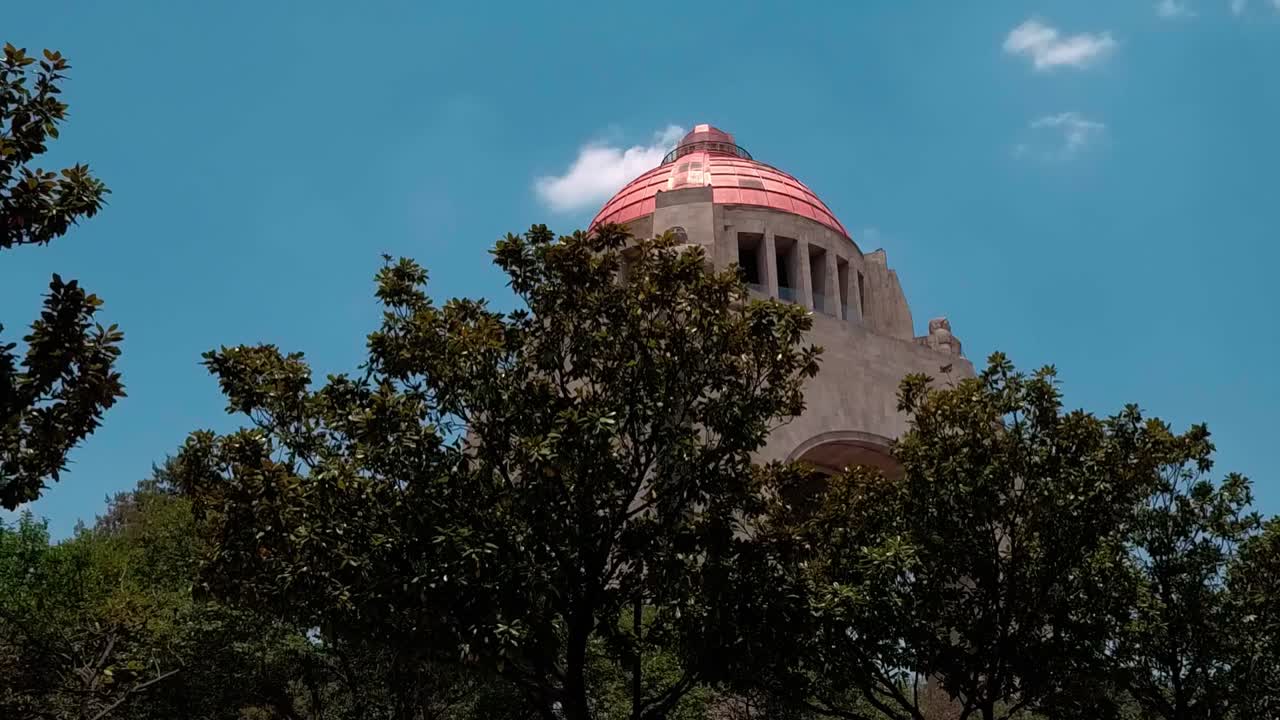 Monument with Copper Dome and Surrounding Trees
