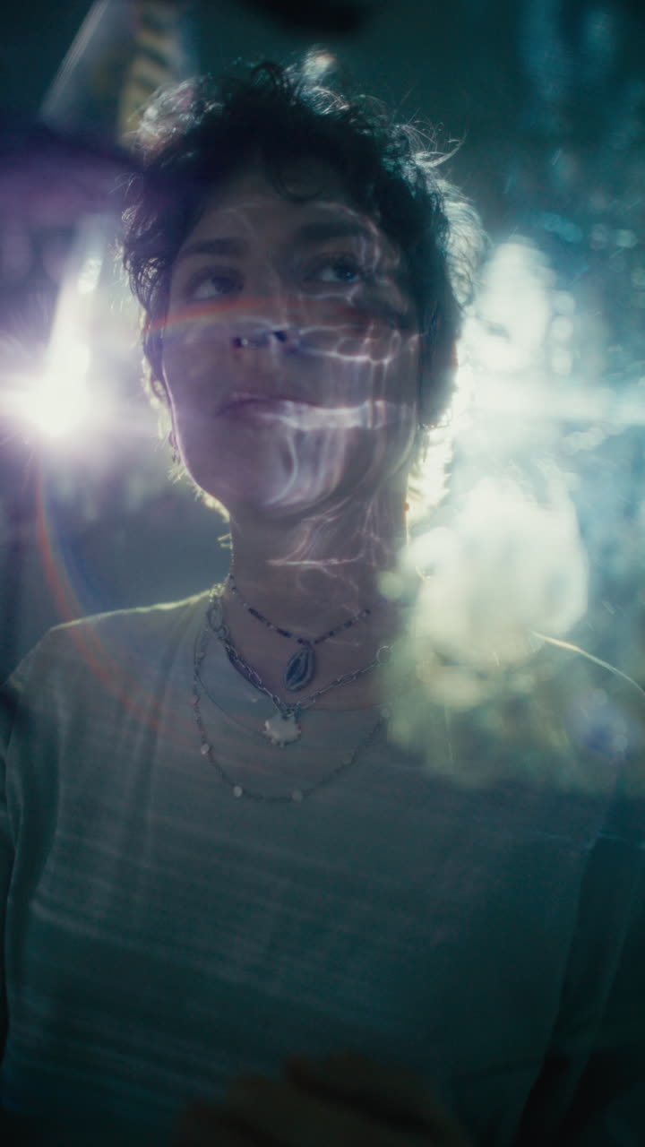 Portrait of Young Woman in Reflected Light Creating Surreal Atmosphere