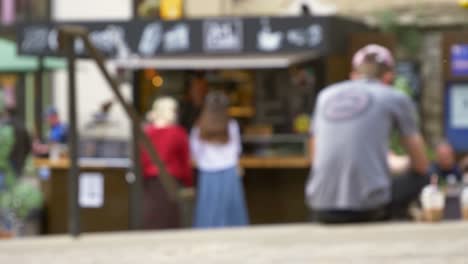 Defocused-Shot-of-Young-Girls-at-Outdoor-Coffee-Stall-In-Oxford-England-01