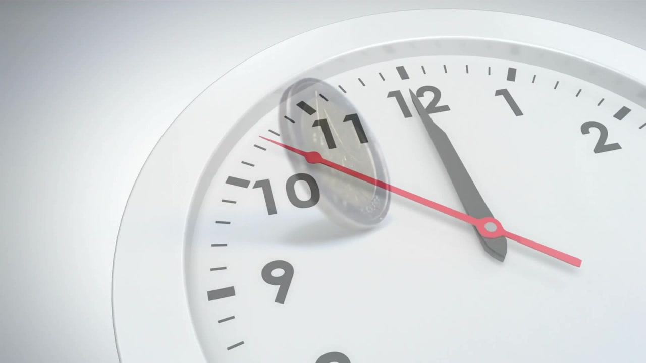 Coin being nudged on clock face rim initiating flipping, tumbling and drifting demonstrating motion