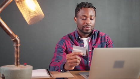 man paying online with credit card