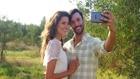 happy couple taking selfie from mobile 4k