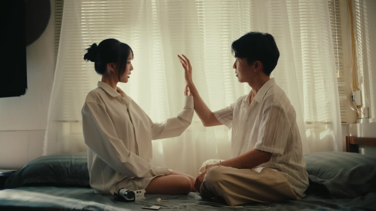 Couple Sitting Together by a Window