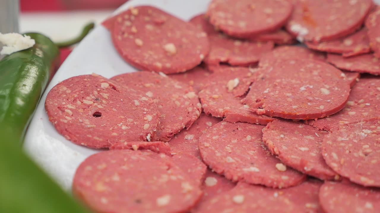 Close-up of Sliced Salami on a White Plate