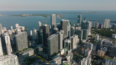 Ascending-footage-of-modern-high-rise-residential-towers-on-sea-bay-waterfront.-Luxury-housing-along-coast.-Miami,-USA
