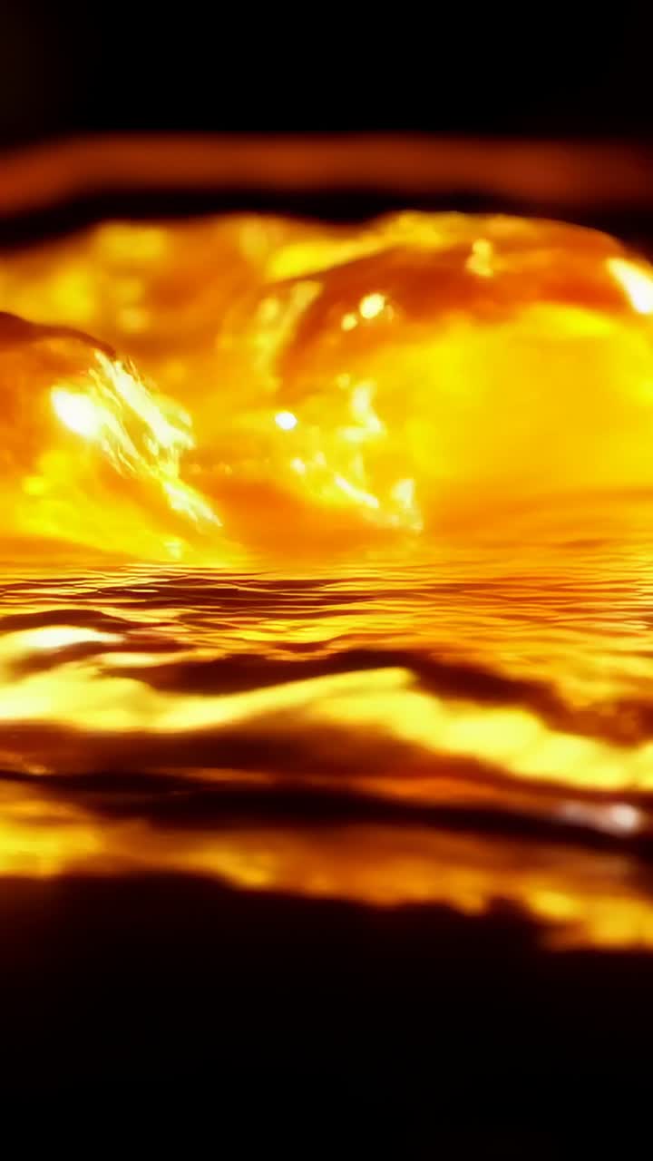 Vertical video: Rippling glowing liquid pool reacting to pulse in macro studio, showing crests