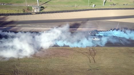 View-Of-Race-Cars-During-Drag-Racing-At-Sydney-Motorsport-Park-In-Eastern-Creek,-Australia---drone-shot