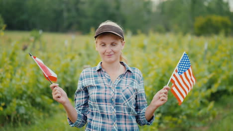 young woman farmer holding the usa flag on one side and the canada flag on the other