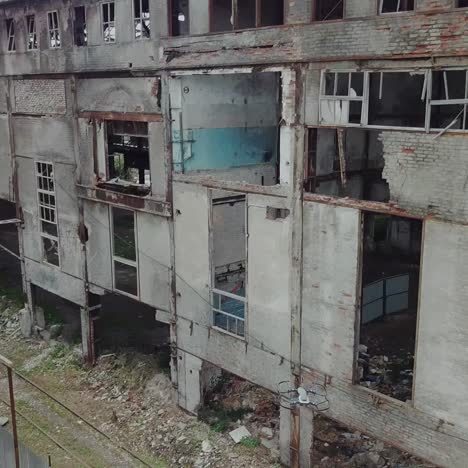 aerial view of abandoned industrial buildings. drone flies over an abandoned factory.
