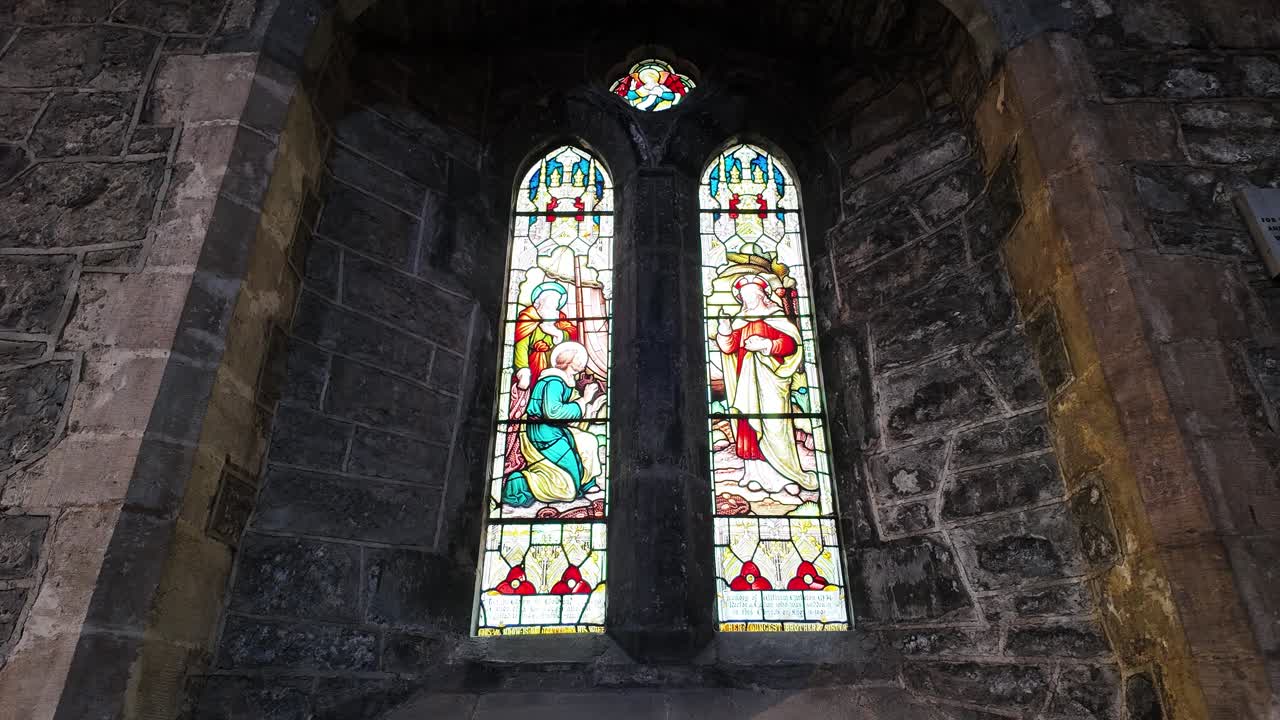 St Canices Cathedral Kilkenny city Ireland ancient stained glass window in this ancient historic building and place of worship for centuries