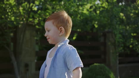 cute boy meeting new dog in yard