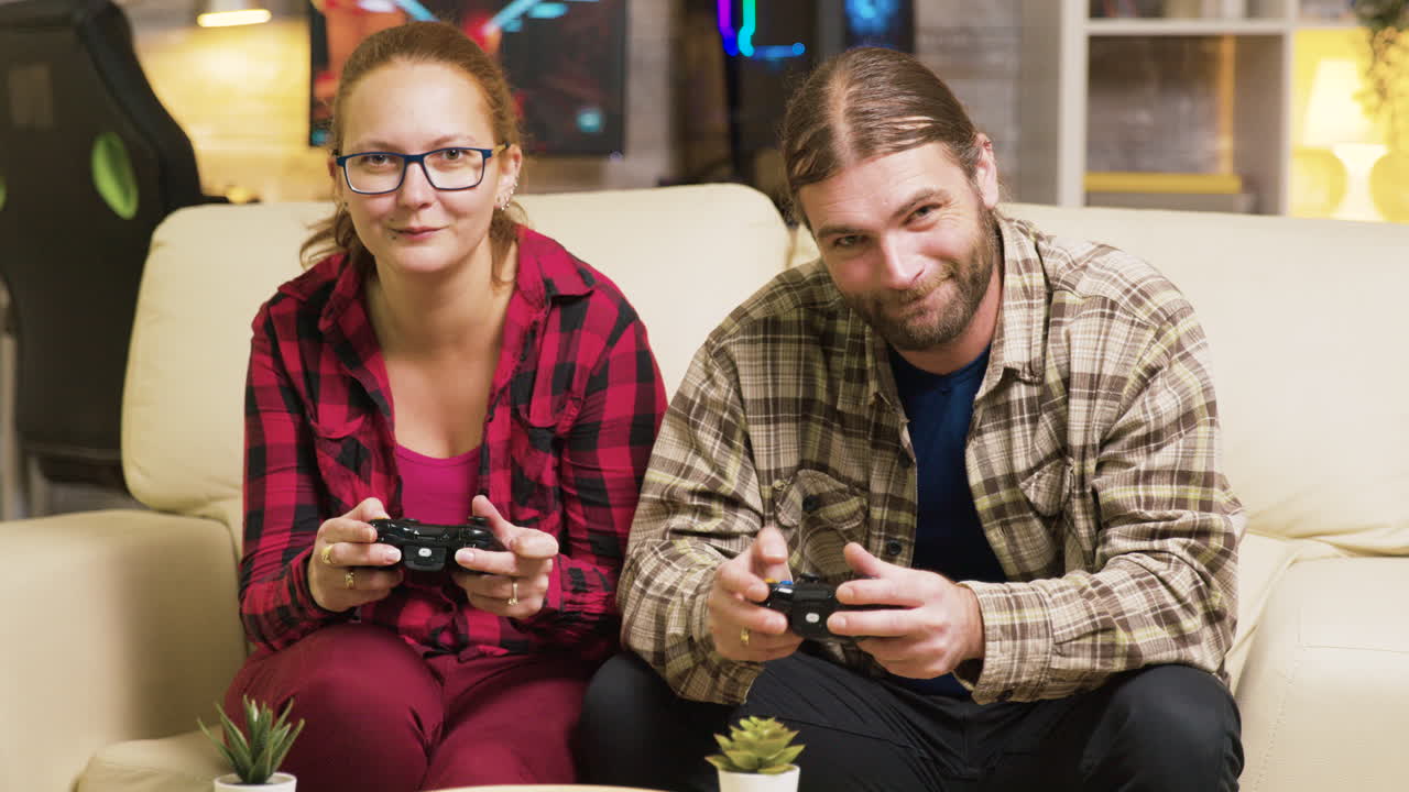 Couple playing video games on console