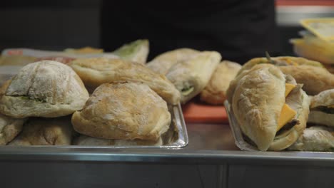 Tracking-shot-of-prepared-ciabatta-panini-sandwiches-and-ciabatta-rolls