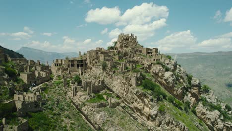 ancient ruined village on a mountain cliffside