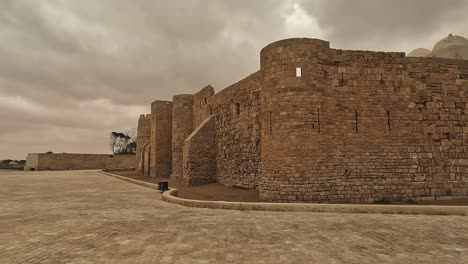 Wide-panoramic-view-of-Borj-El-Kebir-fortress-in-Houmt-El-Souk-on-Djerba-island-in-Tunisia-on-cloudy-day