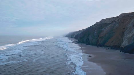 dramatic drone flight at the coast in the morning