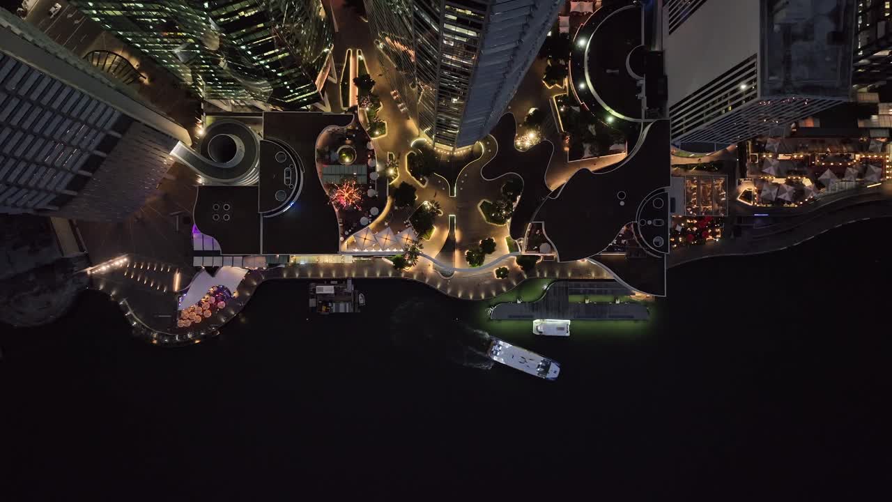 Topdown static aerial shot of Brisbane City's Eagle Street Pier boardwalk at night time